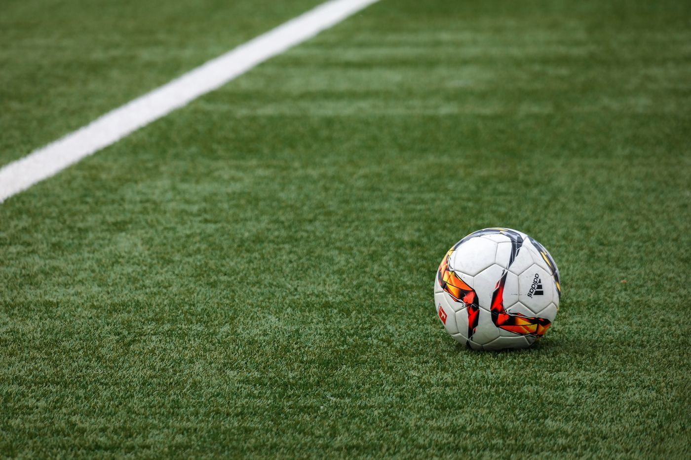 Football on a grass pitch